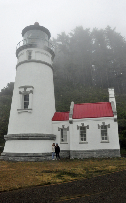Karen Duquette and her sister Ilse Blahak standing in front of Heceta Head Lighthouse